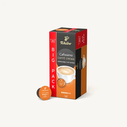 Pudełko kapsułek Tchibo Cafissimo Caffe Crema na białym tle. Obok leży pojedyncza kapsułka.