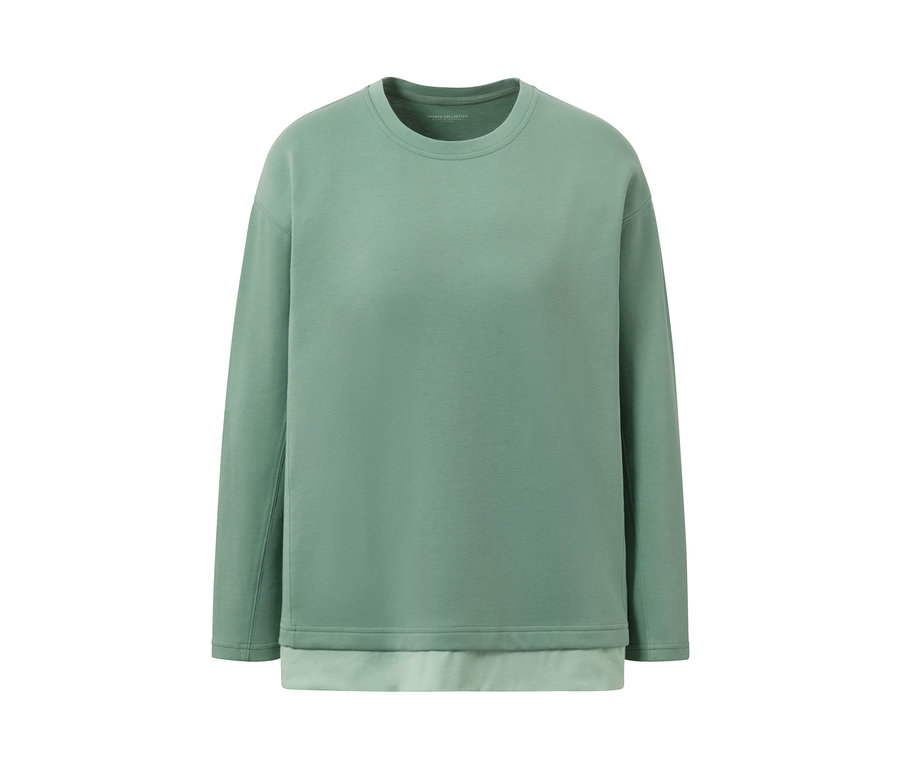 Zielona, oversizowa bluzka z długim rękawem na białym tle.