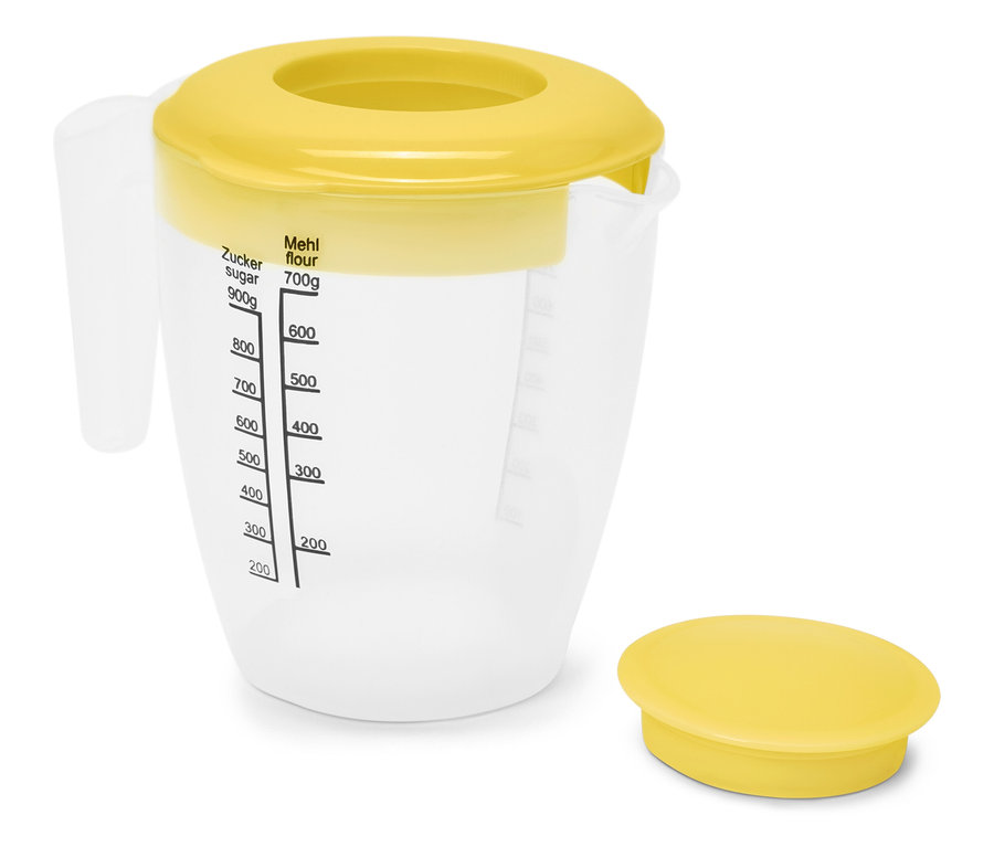 Przezroczysty dzbanek z żółtą pokrywką i oznaczeniami pomiarowymi.
