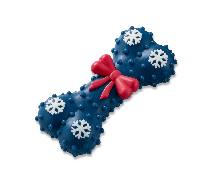 Niebieska zabawka dla psa w kształcie kości z czerwoną kokardą i białymi płatkami śniegu.
