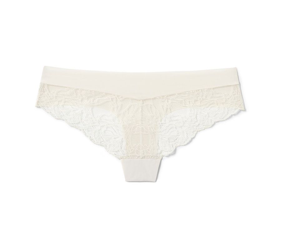 Kremowe figi brazylijskie Magic Cut z kwiatową koronką.