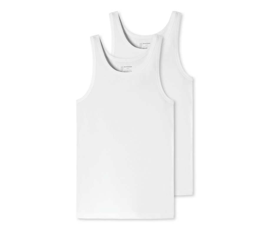 Dwa białe podkoszulki z bawełny ekologicznej SCHIESSER leżą na sobie.