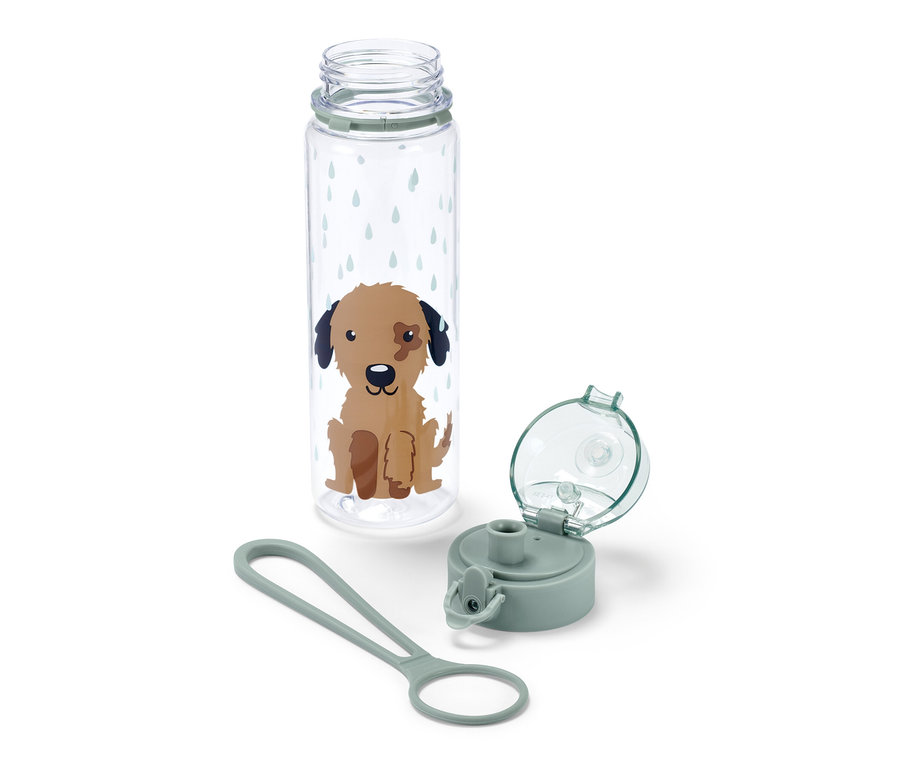 Przezroczysty bidon z rysunkiem psa, nakrętka i pasek do noszenia leżą obok bidonu.