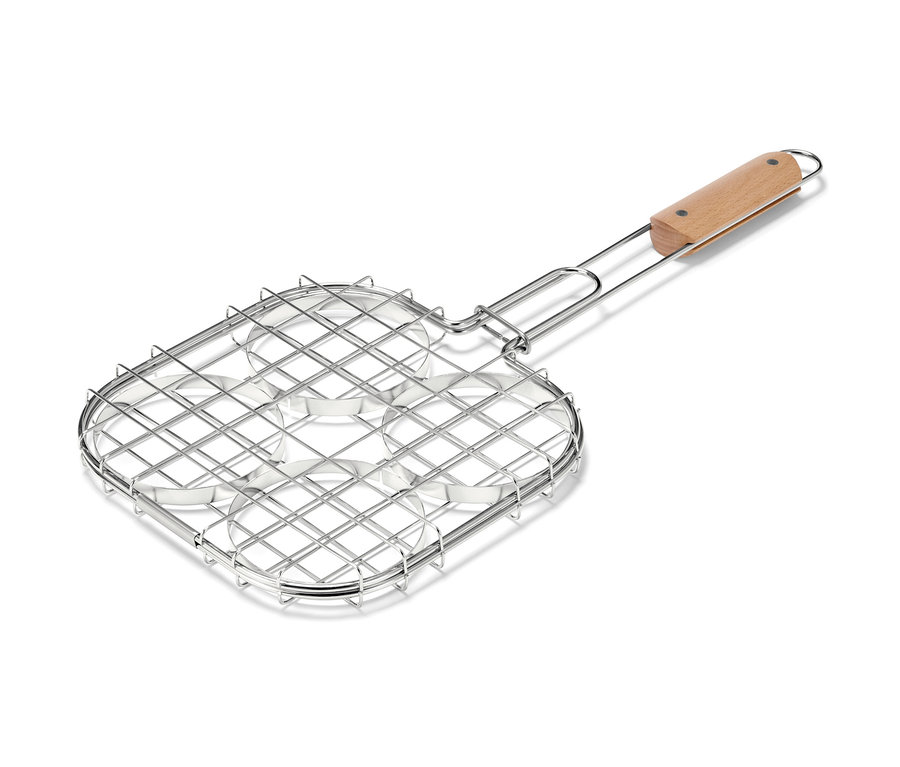 Opiekacz do grillowania burgerów z czterema okrągłymi wgłębieniami i drewnianą rączką.