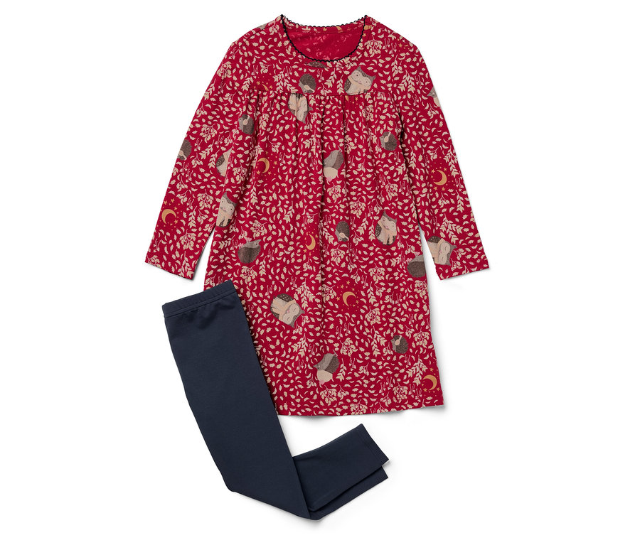 Czerwona sukienka we wzór jeży leży obok granatowych legginsów.