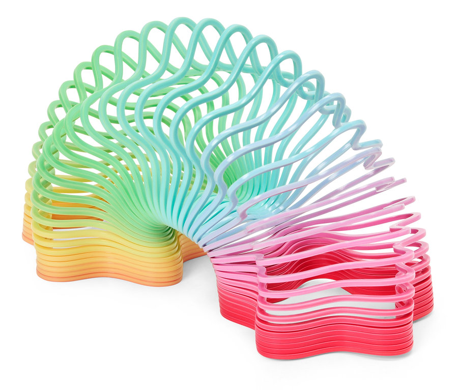 Spiralna zabawka przechodząca od żółtego przez zielony i niebieski do różowego i czerwonego.