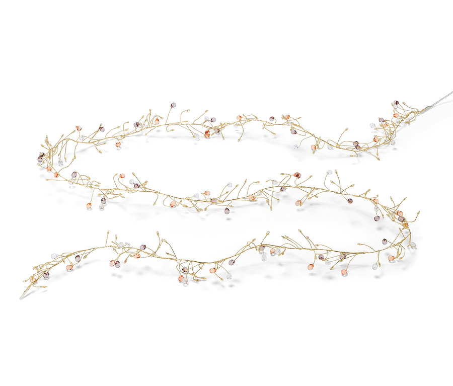 Girlanda LED leży na białym tle.