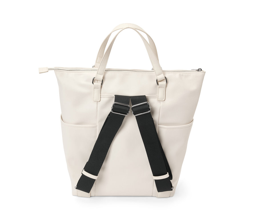 Kremowy płócienny plecak z czarnymi paskami.