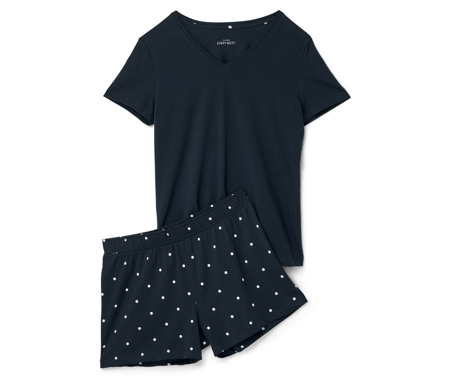 Granatowa piżama z krótkimi spodenkami w białe kropki, składająca się z T-shirtu i szortów.