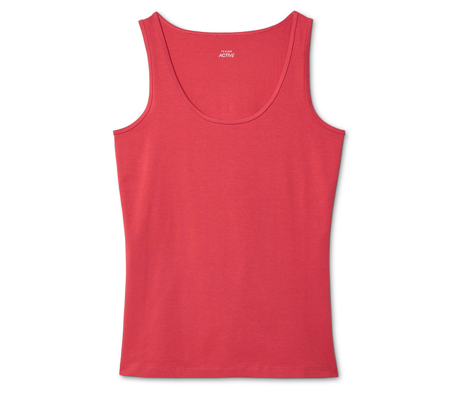 Czerwony tank top leży na białym tle.