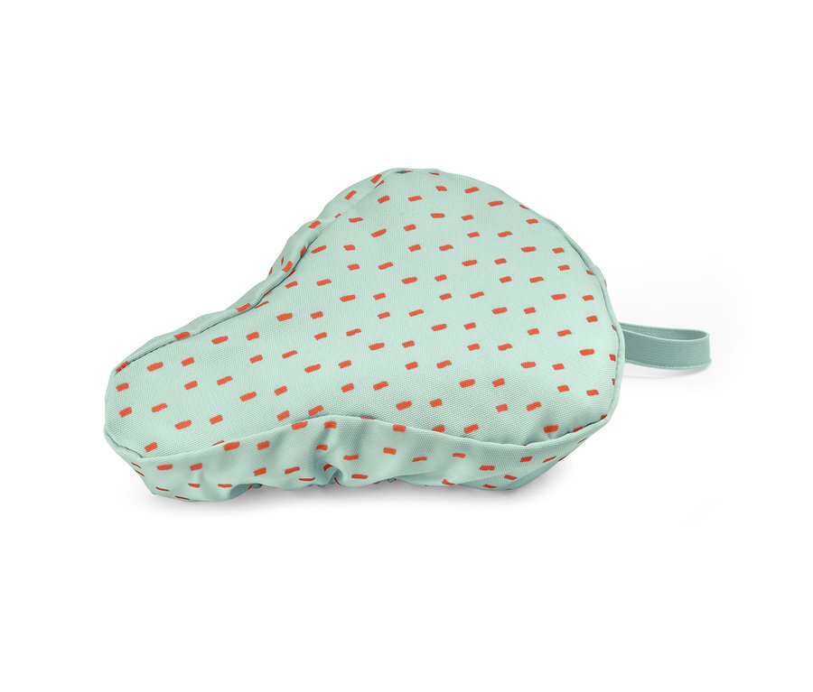 Pokrowiec na siodełko rowerowe dla dzieci, jasnozielony w pomarańczowe kropki.