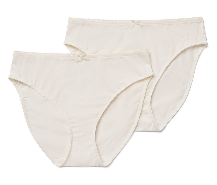 Dwie kremowe figi damskie z kokardką.