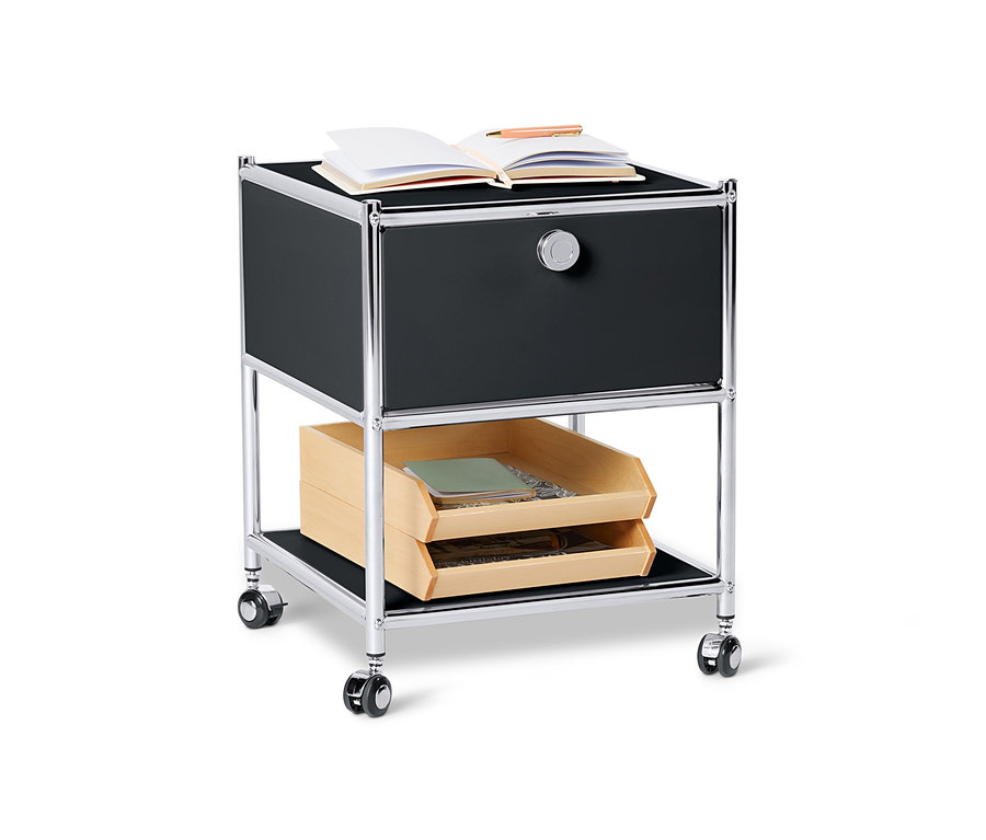 Czarny metalowy stolik »CN3« z szufladą i otwartą książką na górze.