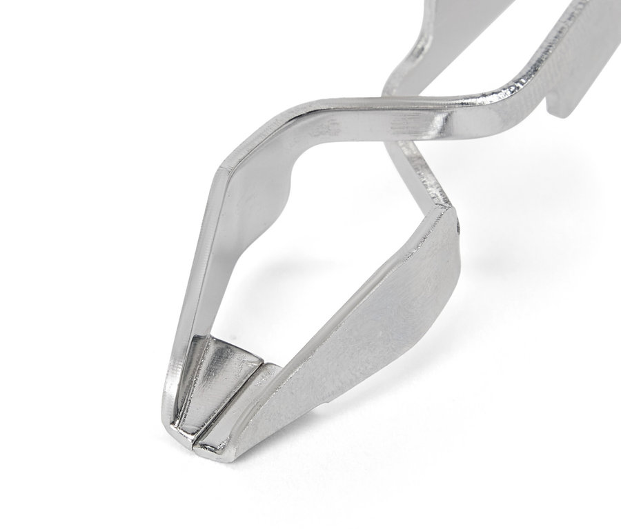 Zbliżenie na przyrząd do usuwania kleszczy u zwierząt z diodą LED.