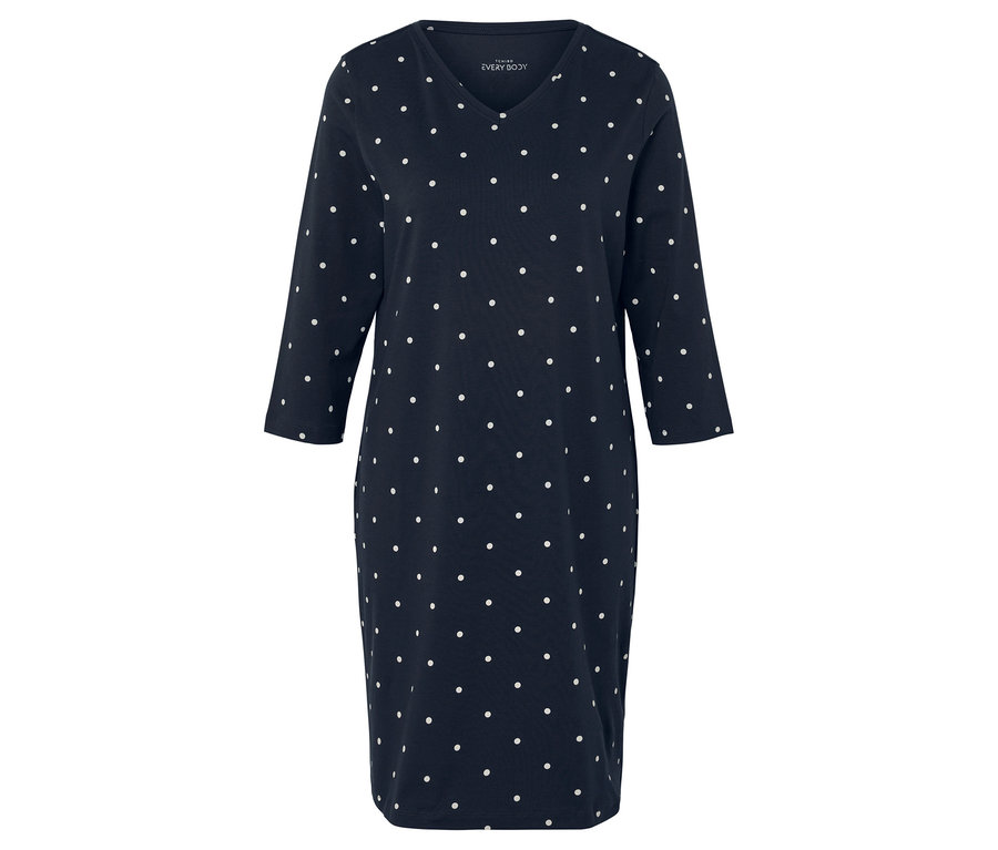 Niebieska sukienka w białe kropki z rękawami 3/4.