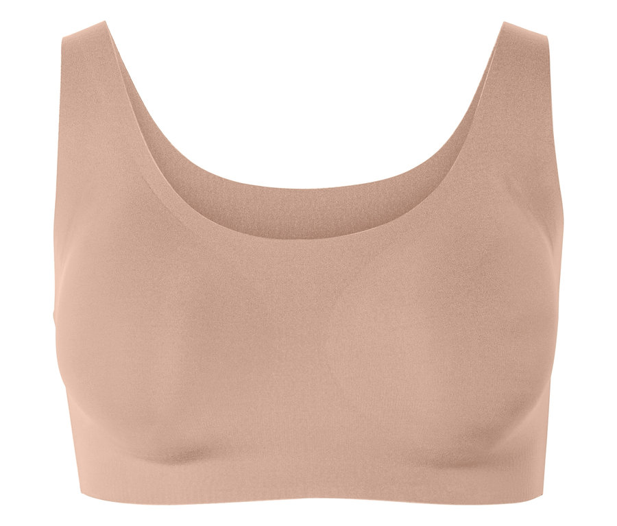 Brzoskwiniowy biustonosz sportowy.