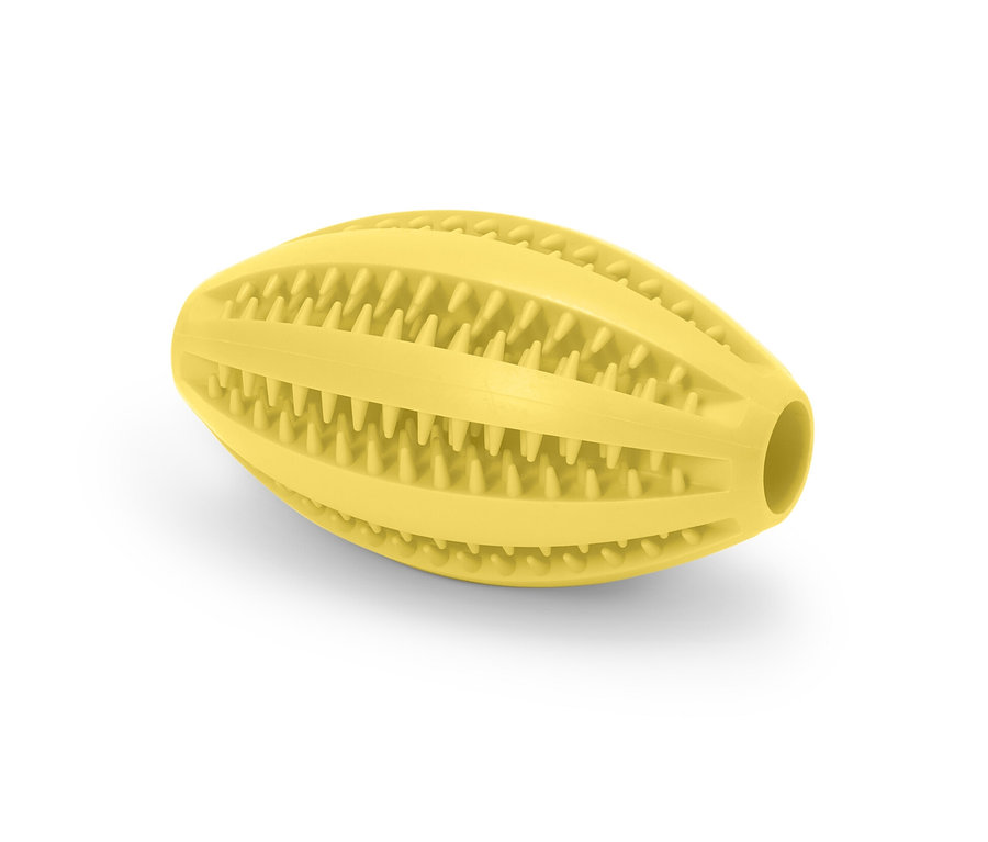 Żółta piłka do pielęgnacji psich zębów.