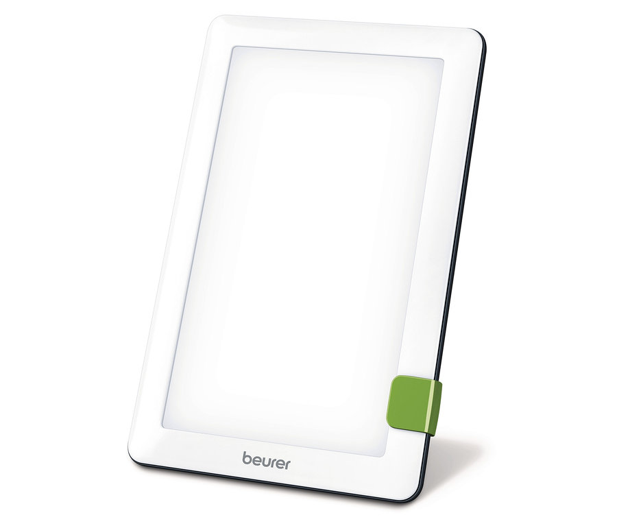 Lampa światła dziennego Beurer z zieloną podstawką na białym tle.