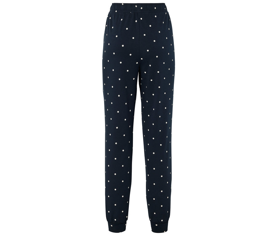 Granatowe spodnie dresowe w białe kropki.