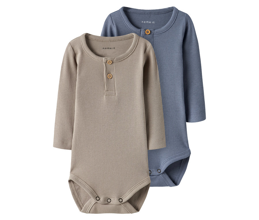 Dwa body niemowlęce NAME IT, troposphere, leżą obok siebie.