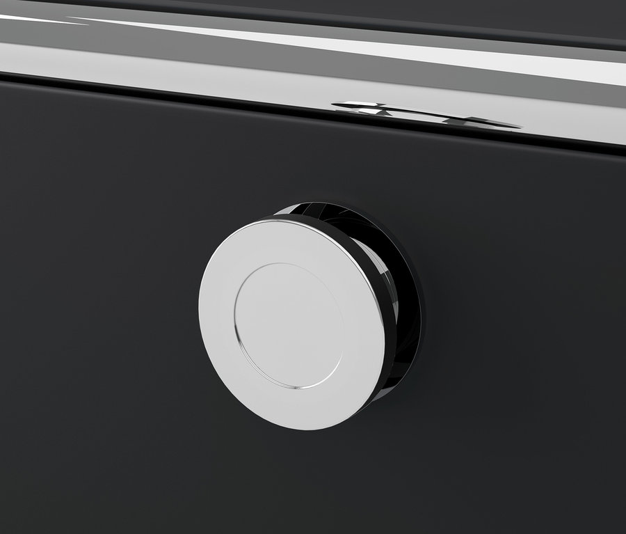 Detal czarnego metalowego mebla CN3 z okrągłą, srebrną rączką.