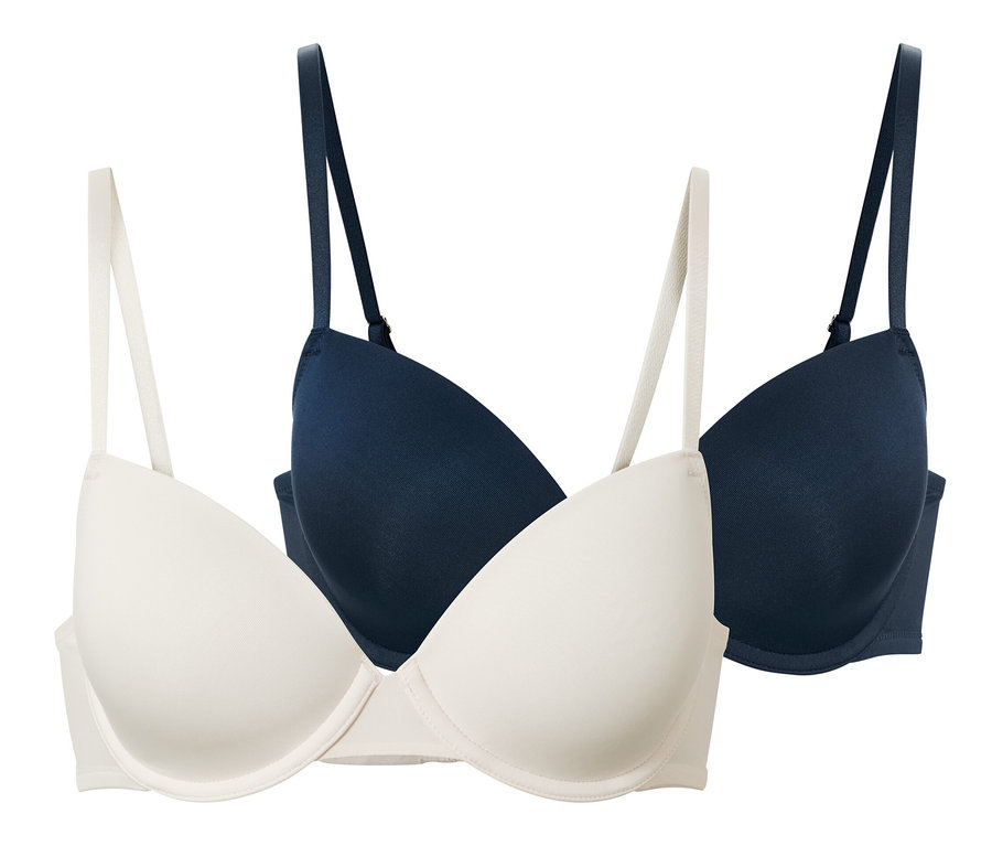 Dwa biustonosze z modelowanymi miseczkami w kolorze kremowym i granatowym.