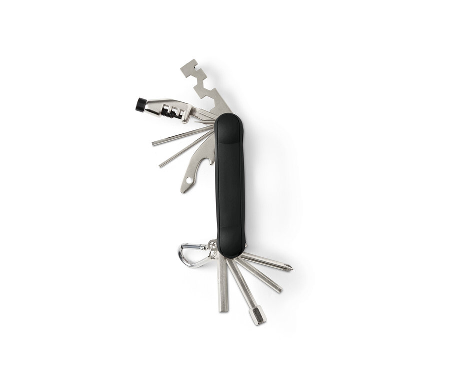 Rozłożone wielofunkcyjne narzędzie rowerowe z czarną rączką i srebrnymi narzędziami.