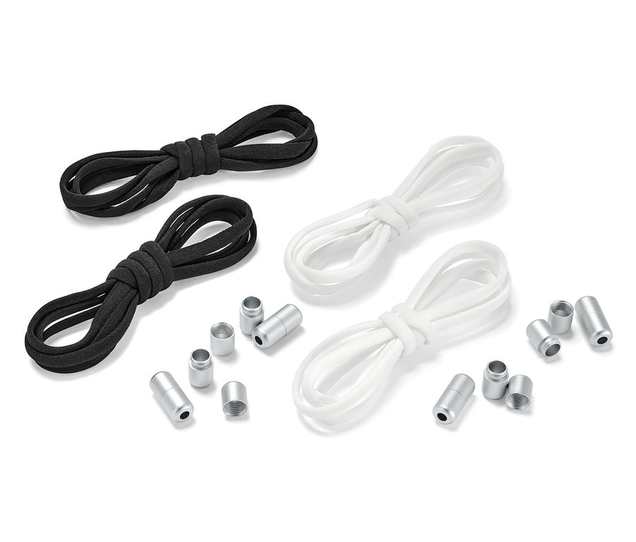 Dwie pary elastycznych sznurowadeł, jedna para czarna i jedna para biała, leżą obok siebie z metalowymi końcówkami.