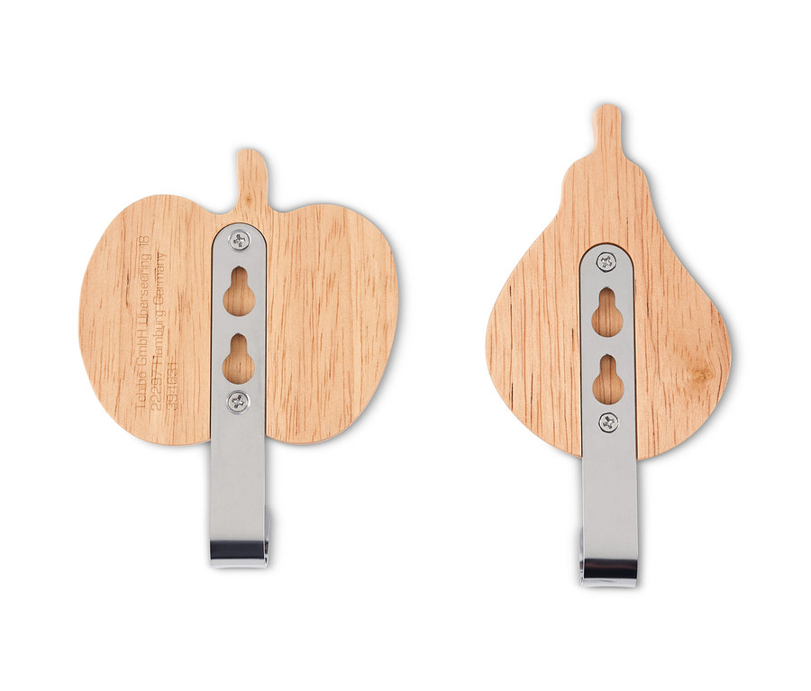 Dwa uchwyty ścienne w kształcie jabłka i gruszki.