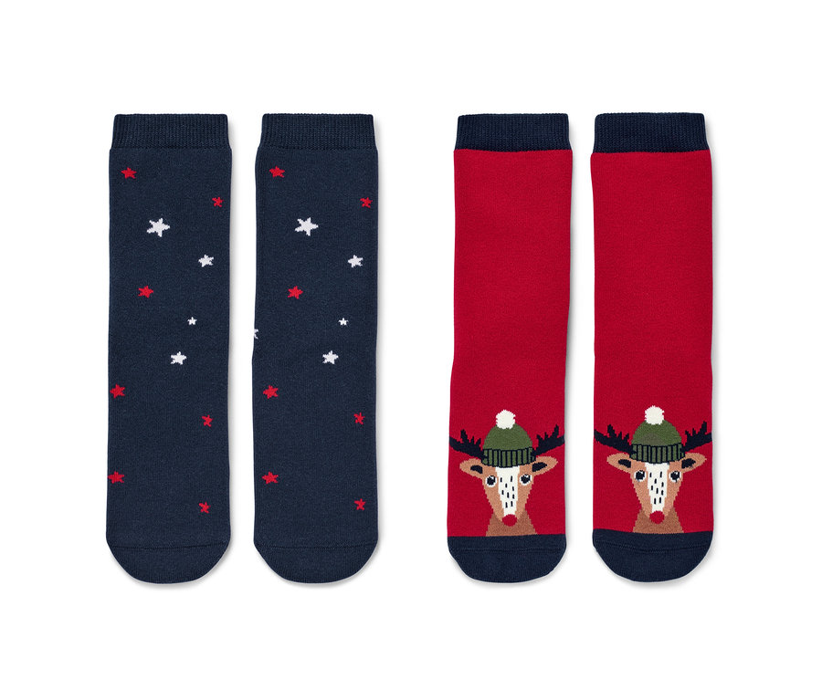 Dwie pary antypoślizgowych skarpet dziecięcych z motywem renifera.