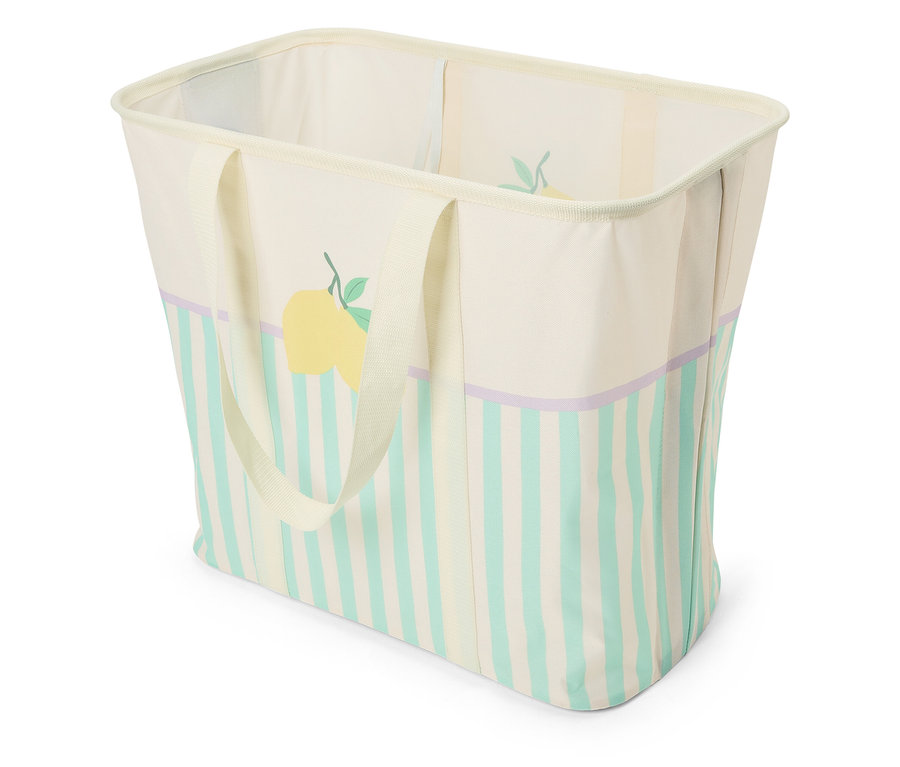 Beżowy kosz z tkaniny z uchwytami, żółtą cytryną i niebieskimi paskami.