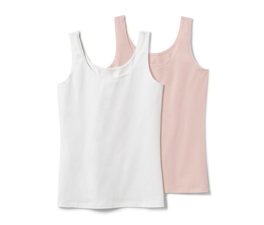 Dwa podkoszulki: biały i różowy.