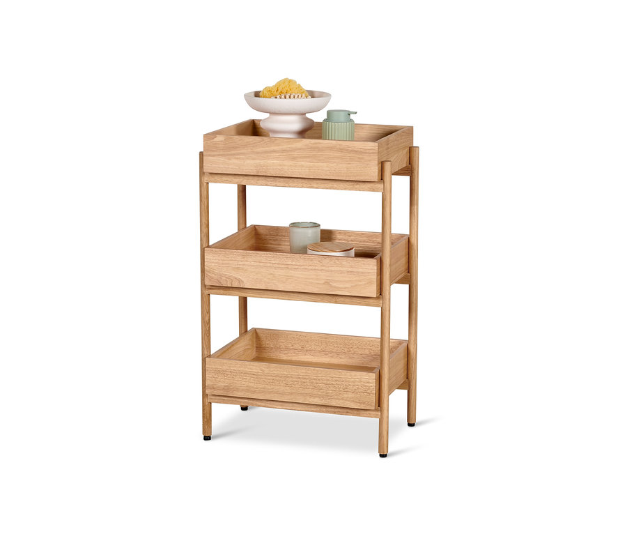 Regał stojący z trzema przegródkami z akcesoriami łazienkowymi.