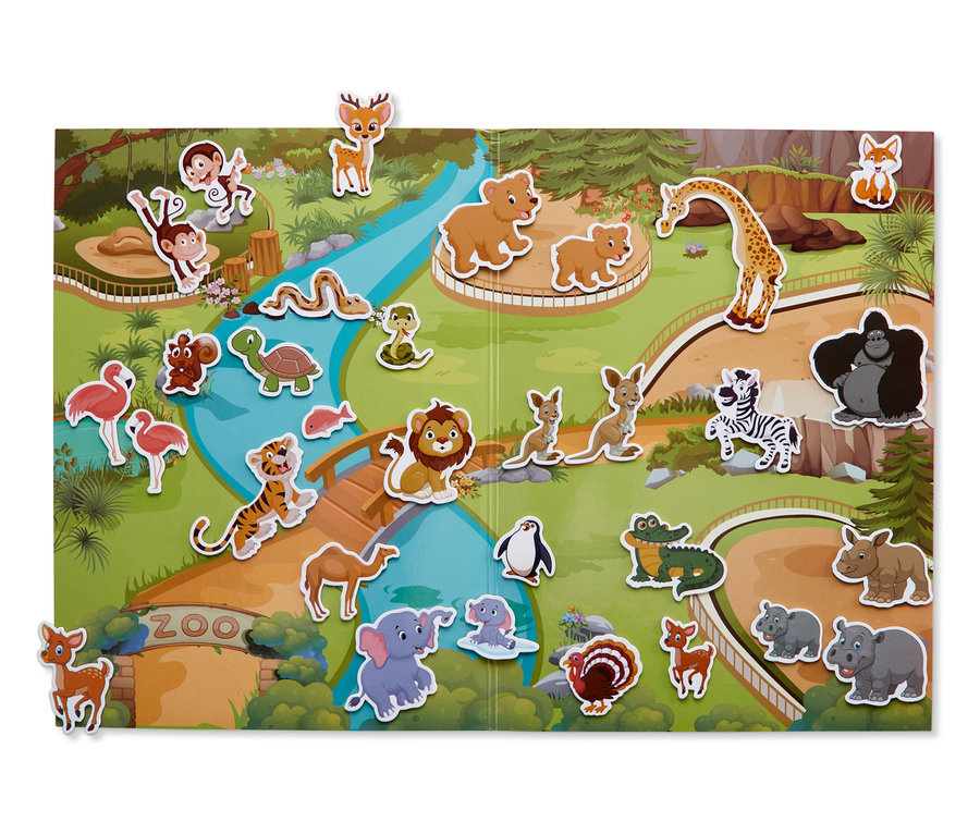 Otwarta magnetyczna książeczka interaktywna z ilustracją zoo i magnesami zwierząt.