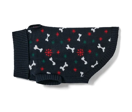 Granatowy sweter dla psa we wzór kości i płatków śniegu.