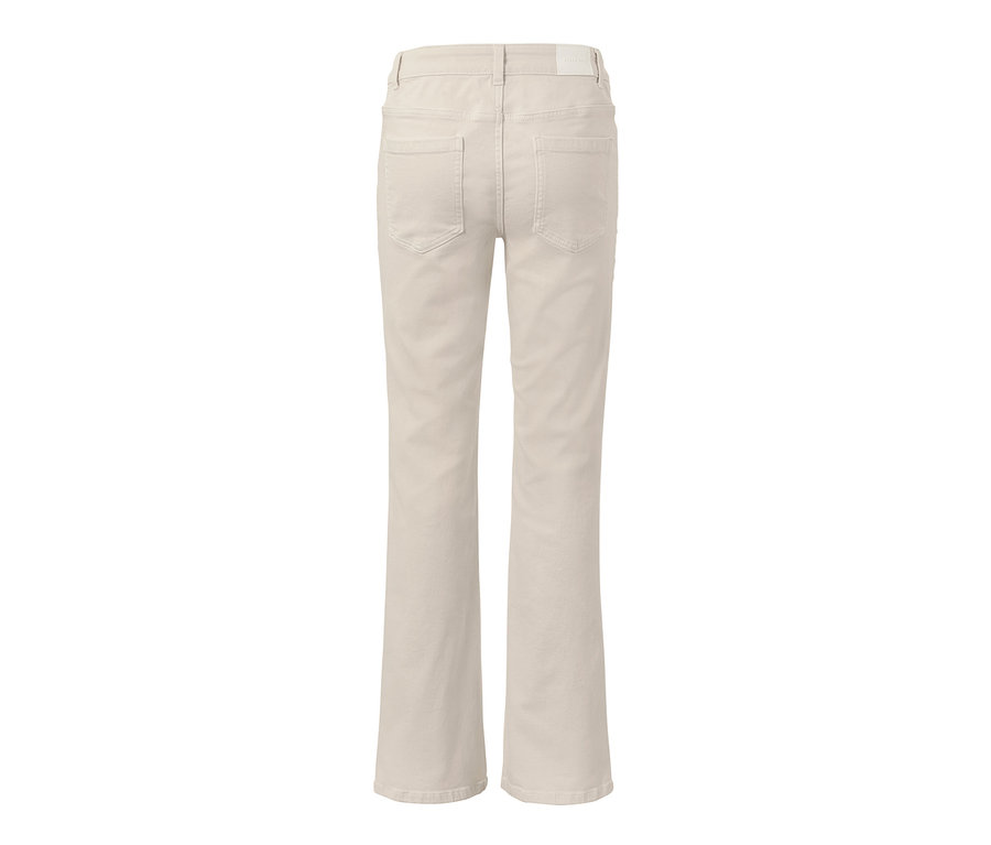 Widok z tyłu kremowych dżinsów bootcut z regularnym stanem.