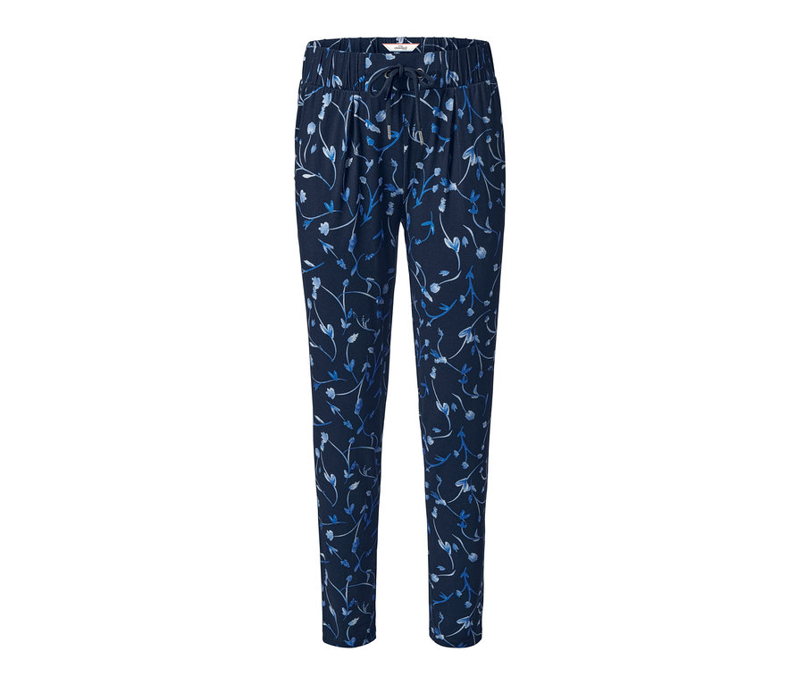 Granatowe spodnie dżersejowe z nadrukiem na całej powierzchni.