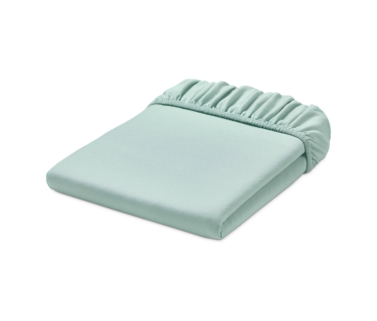 Jasnozielone dżersejowe prześcieradło z gumką, starannie złożone.