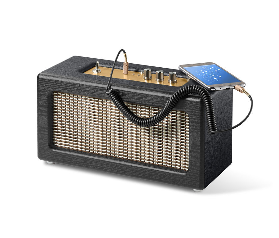 Głośnik Bluetooth® w stylu retro podłączony kablem do telefonu.
