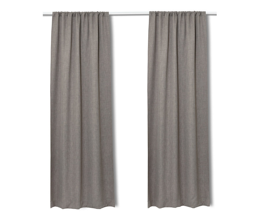 Dwie zasłony zaciemniające wiszą na białym karniszu.