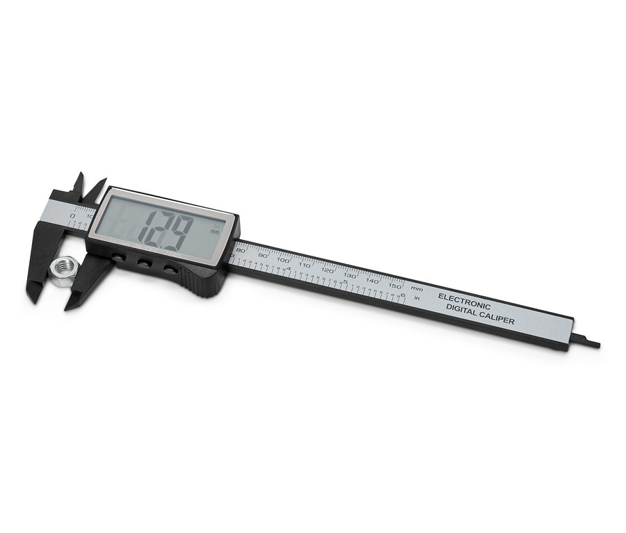 Suwmiarka cyfrowa mierzy nakrętkę.