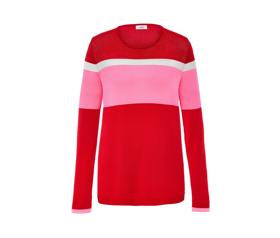 Detal damskiego swetra w stylu color-blocking, czerwono-różowo-białego.