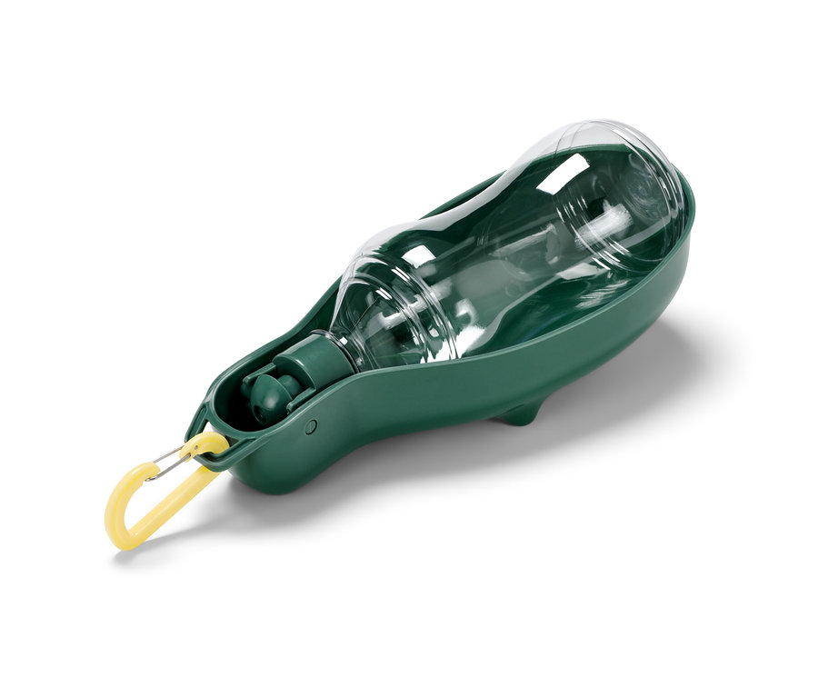 Przezroczysta butelka dla psa z wbudowaną zieloną miską.