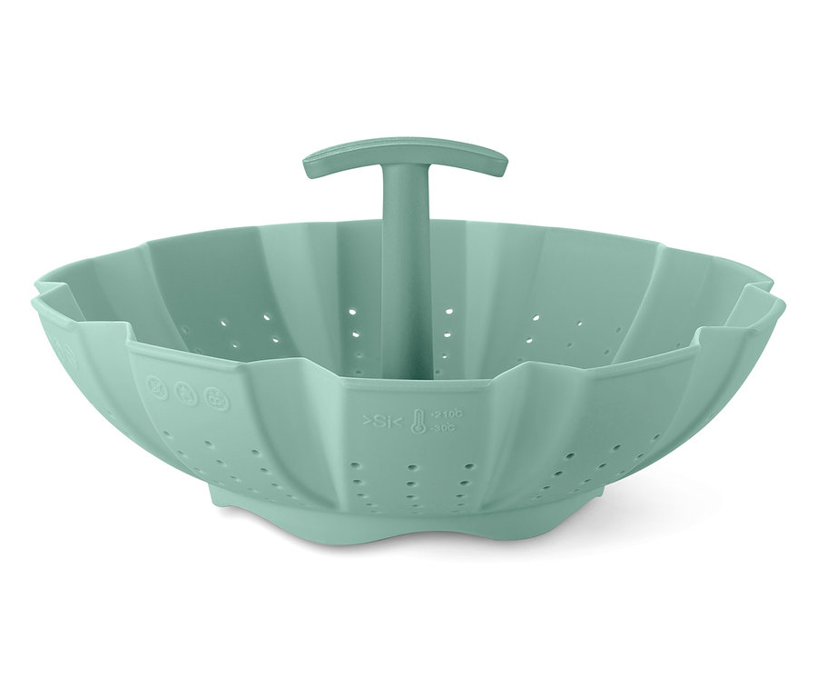 Zielony silikonowy wkład do gotowania na parze z uchwytem pośrodku.