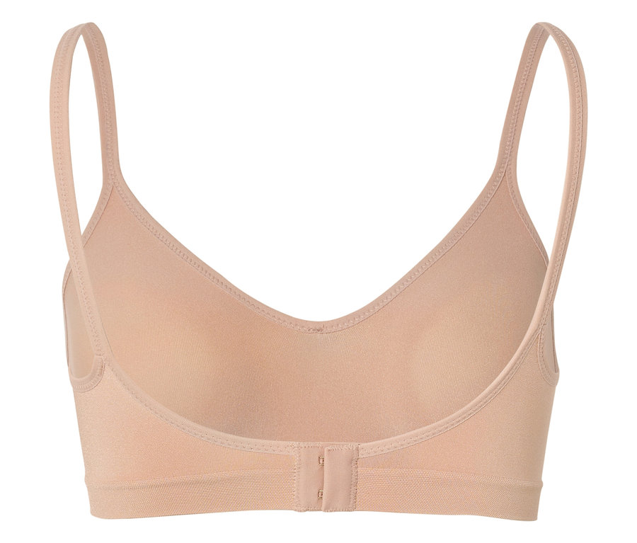 Widok z tyłu beżowego biustonosza na ramiączkach, zapinanego na haftki.