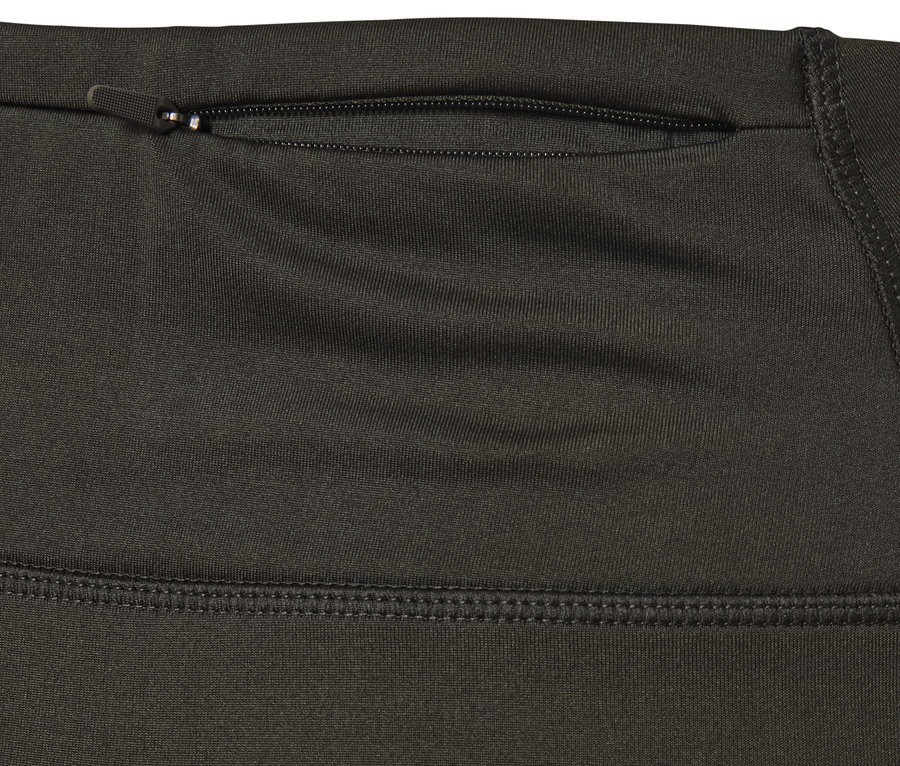 Zbliżenie na termiczne legginsy outdoorowe z zamkiem błyskawicznym.