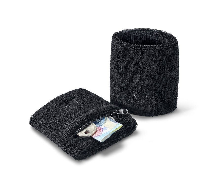 Dwie czarne frotki, jedna zapinana na zamek błyskawiczny, z monetami i banknotami w środku.