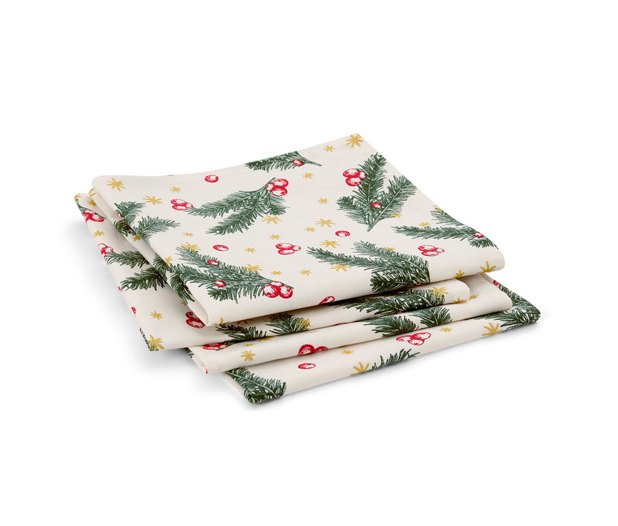 Stos czterech serwetek. Serwetki są zadrukowane zielonymi gałązkami, czerwonymi jagodami i złotymi gwiazdkami.