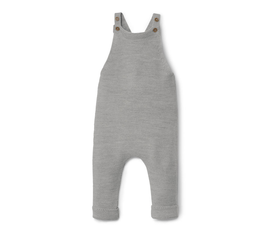 Szare ogrodniczki z wełny merino leżą na białym tle.