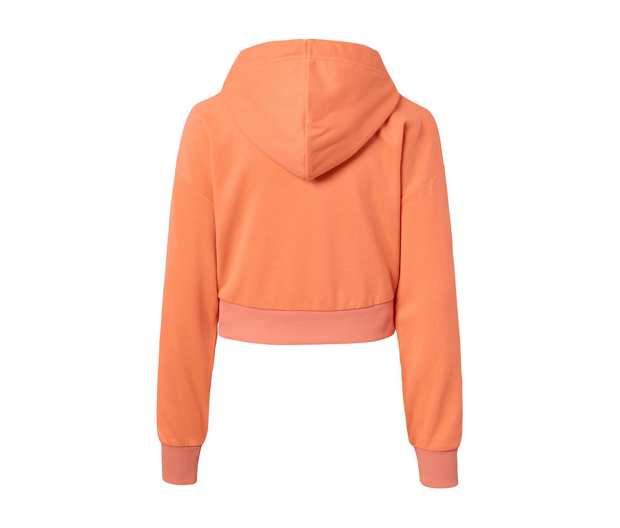 Widok z tyłu krótkiej, pomarańczowej bluzy sportowej.